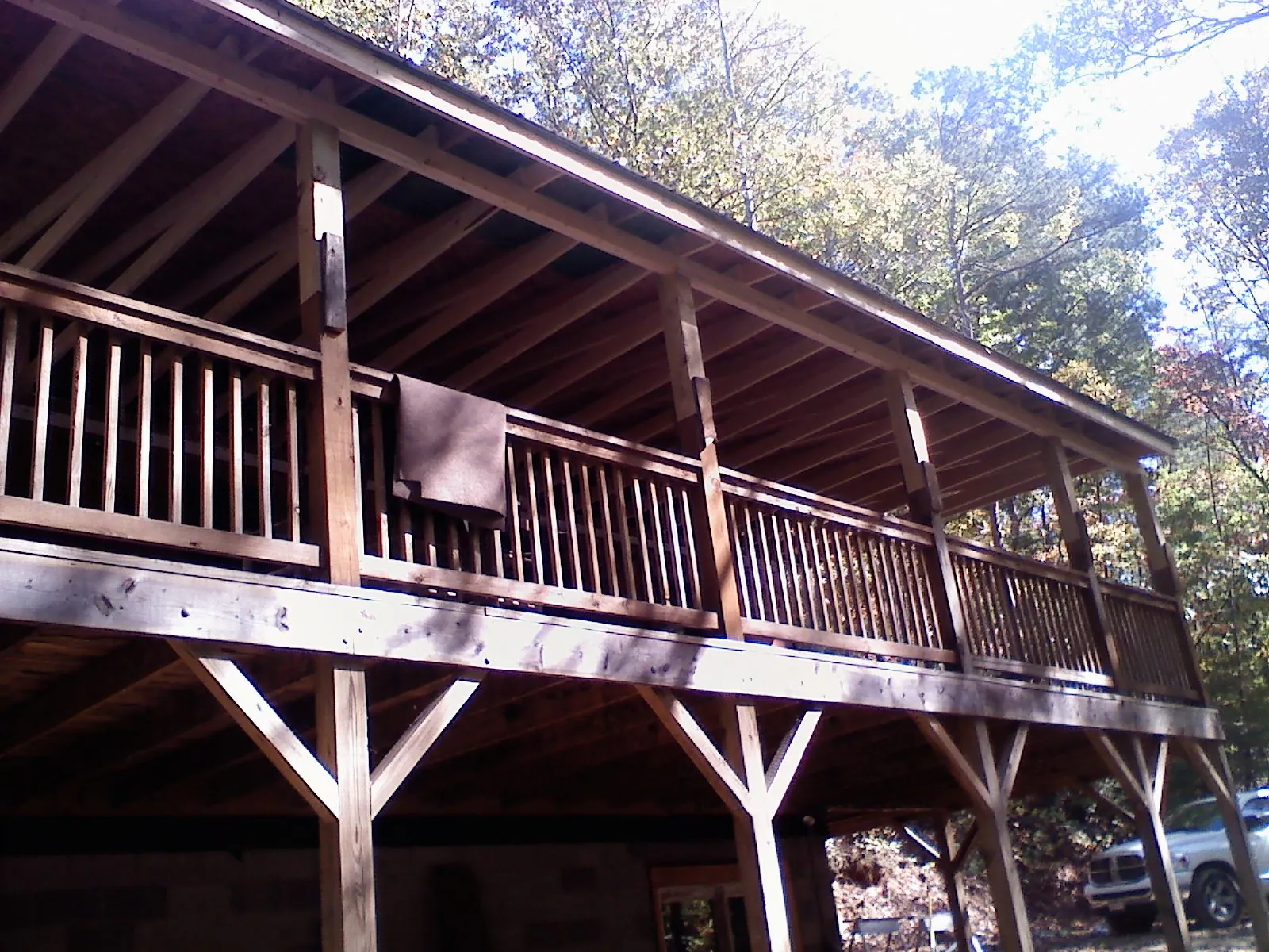 Timber framing under a new elevated porch and deck in Laotto